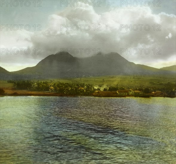 The Soufriere Hills, Montserrat. Low cloud hangs over the volcanic Soufriere Hills at Montserrat. Montserrat, circa 1910. Montserrat, Caribbean, North America .