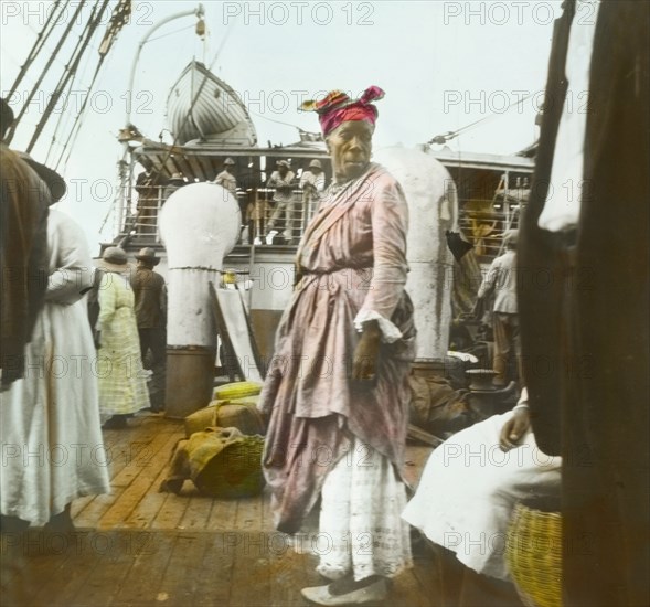 A female fruit vendor aboard the SS Chaleur. Portrait of a female fruit vendor aboard the SS Chaleur, one of many traders who regularly travelled the Caribbean to sell their produce. Roseau, Dominica, circa 1910. Roseau, St Andrew (Dominica), Dominica, Caribbean, North America .