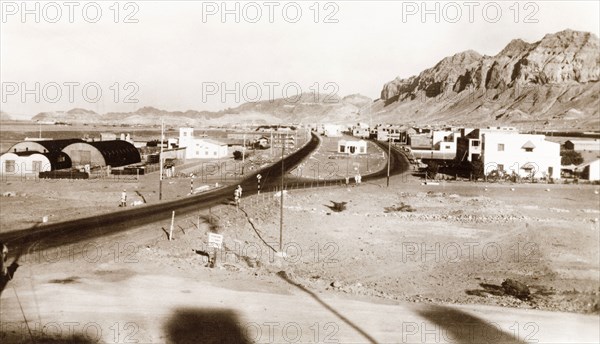 Road leading to a crater, Aden. A main road leads away into the distance, towards the crater of an extinct volcano. Aden, Yemen, 1943. Aden, Adan, Yemen, Middle East, Asia.