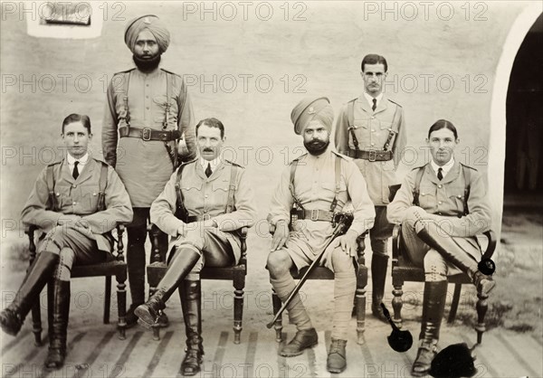 Six British and Indian VCOs. Six VCOs (Viceroy's Commissioned Officers) of the Indian Army pose for a group portrait dressed in military uniform. Multan, Punjab, India (Pakistan), 1916. Multan, Punjab, Pakistan, Southern Asia, Asia.