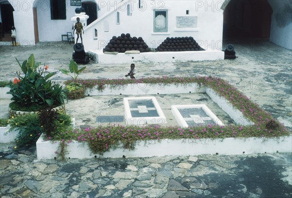 Graves of Captain George Maclean and his wife. The graves of Captain George MacLean (d. 1847), Governor of Cape Coast from 1830 to 1847, and his wife, Letitia Elizabeth Landon (d.1838), located at Cape Coast Castle. Cape Coast, Ghana, 3 July 1960. Cape Coast, Central (Ghana), Ghana, Western Africa, Africa.