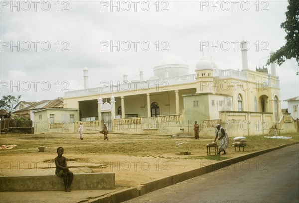 Mosque at Saltpond, Ghana. View of Saltpond Mosque, an enclosed structure featuring a central dome surrounded by minarets. Saltpond, Ghana, January 1958. Saltpond, West (Ghana), Ghana, Western Africa, Africa.