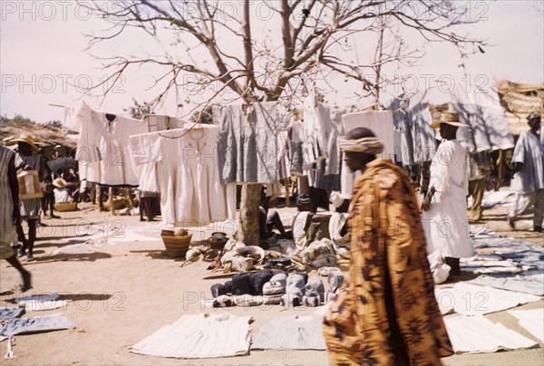 Smocks at Bolgatanga market. A range of smocks and textiles are displayed on a stall at Bolgatanga market. Bolgatanga, Ghana, circa 1961. Bolgatanga, Upper East, Ghana, Western Africa, Africa.