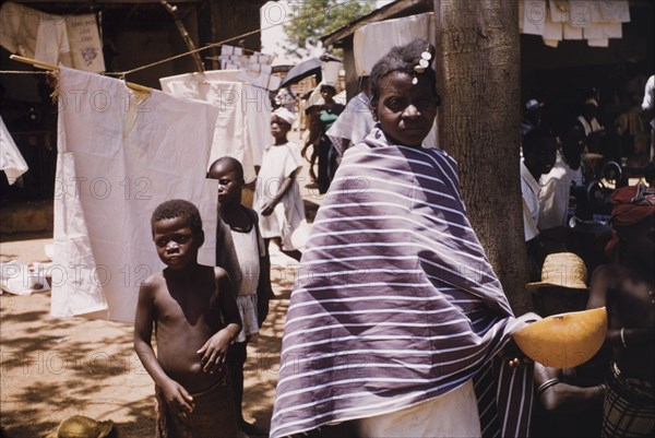 A Fulani woman at Bawku market. Portrait of a Fulani woman, pictured in the smock section at Bawku market. Bawku, Ghana, circa March 1961. Bawku, Upper East, Ghana, Western Africa, Africa.