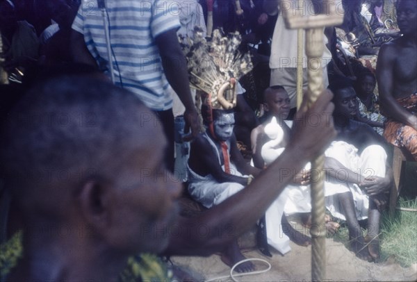 The 'soul' of Mate Kole II. A child with an elaborate headdress and painted face represents the 'soul' of Mate Kole II (1910-1990), the Paramount Chief or Konor of Manya Krobo, during an annual Ngmayem harvest festival. Odumasi, Ghana, circa 1960. Odumasi, East (Ghana), Ghana, Western Africa, Africa.