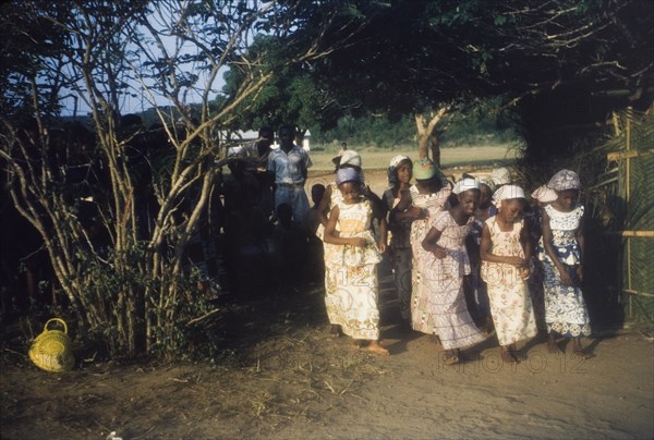 Girls dance in a nativity play. A group of girls perform a dance routine as part of a nativity play production. Ghana, circa 1960. Aba, Abd Allah, Ghana, Western Africa, Africa.