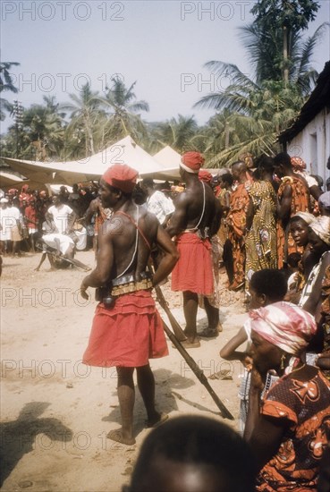 Asafo Number Two Company members with guns. Asafo Number Two Company members hold guns at a ceremony in Lowtown. Saltpond, Ghana, April 1960. Saltpond, West (Ghana), Ghana, Western Africa, Africa.
