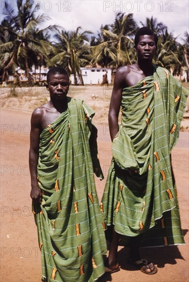 Ghanaian men in kente cloth. Portrait of two Ghanaian men dressed up in traditional kente cloth. Saltpond, Ghana, March 1957. Saltpond, West (Ghana), Ghana, Western Africa, Africa.