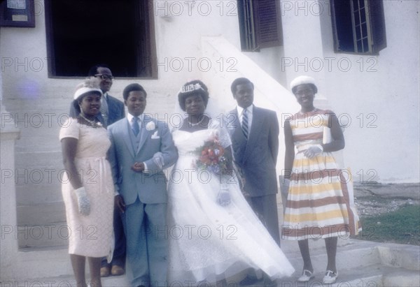 Ghanaian wedding party. A Ghanaian wedding party poses for a group portrait. Ghana, 23 April 1960. Ghana, Western Africa, Africa.