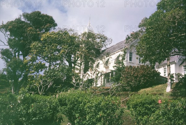 Government House, St Lucia. View through the trees of Government House in St Lucia, a colonial building constructed by the British government in 1895. Castries, St Lucia, circa 1975. Castries, St Lucia, St Lucia, Caribbean, North America .