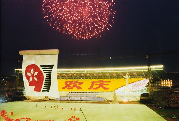 Fireworks for the handover of Hong Kong. Fireworks explode over Beijing stadium during celebrations to mark the transfer of Hong Kong's sovereignty from the United Kingdom to the People's Republic of China. Beijing, China, 1 July 1997. Beijing, Beijing, China, People's Republic of, Eastern Asia, Asia.