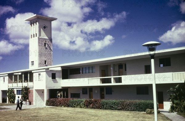 Cave Hill Campus, University of West Indies. View of Cave Hill campus at the University of West Indies in Barbados. The low, two-storey building features verandas running the length of the facade and a colonial-style, square clock tower. Cave Hill, Barbados, circa 1975. Cave Hill, St Michael, Barbados, Caribbean, North America .