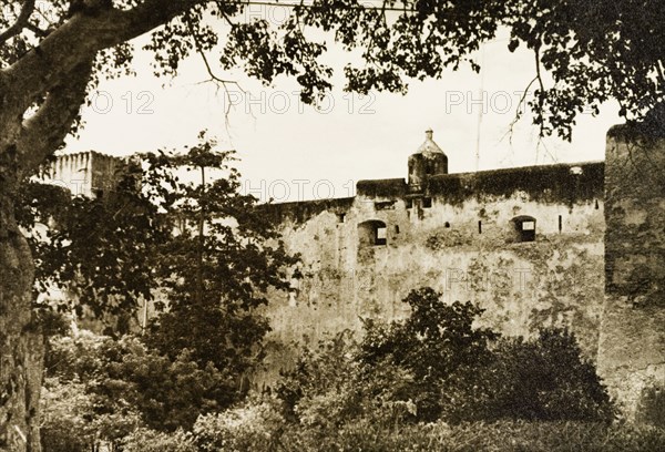 Fort Jesus in Mombasa. The defensive outer wall of Fort Jesus. At the time of this photograph, and up until 1958 while Kenya was a British colony, the fort was used as a government prison. Mombasa, Kenya, 1933. Mombasa, Coast, Kenya, Eastern Africa, Africa.