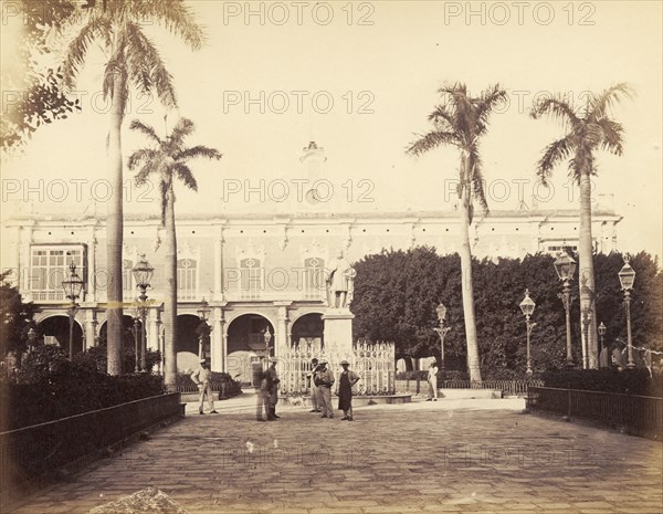 Government building, Cuba. A statur stands in a piazza outside a Cuban government building. Cuba, circa 1927. Cuba, Caribbean, North America .