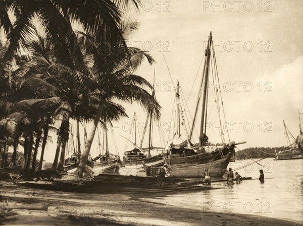 Kothias on the Baliapatuam River. Several 'kothias' (trading boats), moored on the shores of the Baliapatuam River at the small coastal village of Azhikkal. Malabar District (Kerala), India, circa 1936., Kerala, India, Southern Asia, Asia.