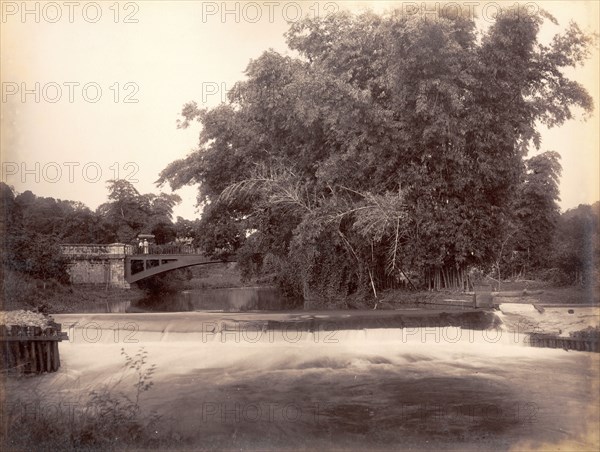 Weir on the Martha Brae River. A footbridge crosses a weir on the Martha Brae River. Trelawny, Jamaica, circa 1891., Trelawny, Jamaica, Caribbean, North America .