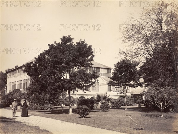 Sir Henry Arthur and Lady Blake in Kingston. Sir Henry Arthur and Lady Blake take a stroll in the grounds of Old King's House, the traditional Kingston residence of colonial governors, which was built in 1773. Blake became the Captain General and Governor-in-Chief of Jamaica in 1889, a position he held until 1898. Kingston, Jamaica, circa 1891. Kingston, Kingston, Jamaica, Caribbean, North America .