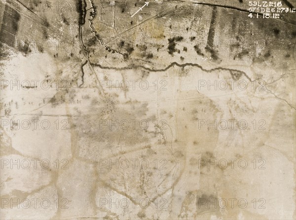 Aerial view of trenches in the snow. One of a series of British aerial reconnaissance photographs recording the positions of trenches on the Western Front during the First World War. An original caption indicates the positions of guns and point out shell bursts on the snow-covered ground. Nord-Pas de Calais or Picardie, France, 4 January 1918., Nord-Pas de Calais, France, Western Europe, Europe .