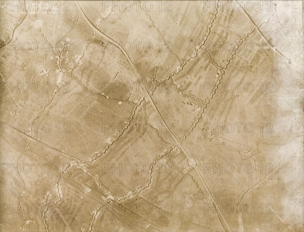 A trench system on the Western Front. One of a series of British aerial reconnaissance photographs recording the positions of trenches on the Western Front during the First World War. An intricate trench system zig-zags its way across the fields. An original caption identifies a front line, probably British, intersected by support, reserve and communication trenches, and points out the positions of gun posts and dugouts. Nord-Pas de Calais or Picardie, France, 30 January 1918., Nord-Pas de Calais, France, Western Europe, Europe .