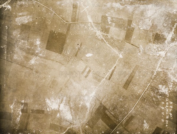 Aerial view of fields on the Western Front. One of a series of British aerial reconnaissance photographs recording the positions of trenches on the Western Front during the First World War. A patchwork of fields is pockmarked with bomb craters. An original caption denotes this as a site for gas projectors. Nord-Pas de Calais or Picardie, France, 11 September 1917., Nord-Pas de Calais, France, Western Europe, Europe .