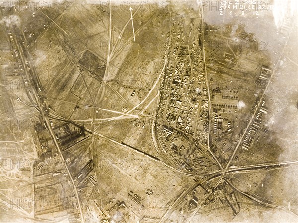 Military camp in a ruined village. One of a series of British aerial reconnaissance photographs recording the positions of trenches on the Western Front during the First World War. A military camp, probably British, based in the ruins of a bomb-damaged village. Nord-Pas de Calais or Picardie, France, 2 February 1918., Nord-Pas de Calais, France, Western Europe, Europe .