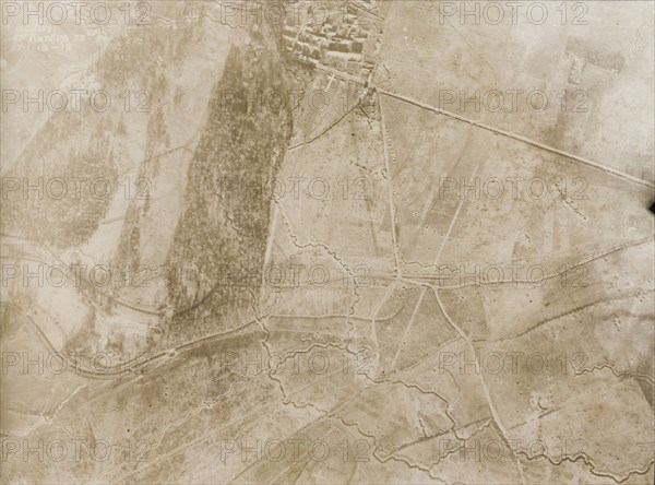 Aerial view of a trench system on the Western Front. One of a series of British aerial reconnaissance photographs recording the positions of trenches on the Western Front during the First World War. An intricate trench system zig-zags its way across snow-covered fields on the outskirts of a bomb-damaged village. Nord-Pas de Calais or Picardie, France, 30 January 1918., Nord-Pas de Calais, France, Western Europe, Europe .