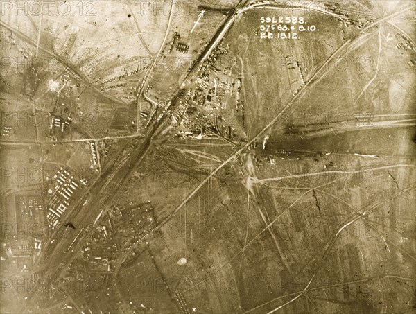 Aerial view of a military camp on the Western Front. One of a series of British aerial reconnaissance photographs recording the positions of trenches on the Western Front during the First World War. Transport tracks run towards a military camp, probably British, which is stationed beside a main road or a railway track running north to south. Nord-Pas de Calais or Picardie, France, 2 February 1918., Nord-Pas de Calais, France, Western Europe, Europe .