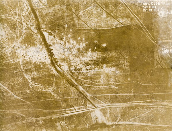 Aerial view of a bomb-damaged landscape. One of a series of British aerial reconnaissance photographs recording the positions of trenches on the Western Front during the First World War. Trenches and bomb craters are highlighted by drifted snow in the fields of northern France. Nord-Pas de Calais or Picardie, France, 22 December 1917., Nord-Pas de Calais, France, Western Europe, Europe .