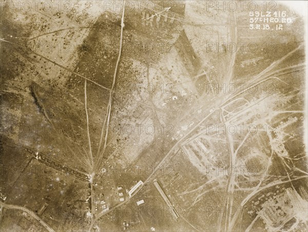 Transport tracks and trenches on the Western Front. One of a series of British aerial reconnaissance photographs recording the positions of trenches on the Western Front during the First World War. Transport tracks and trenches scar a battlefield pockmarked with bomb craters. Nord-Pas de Calais or Picardie, France, 3 February 1918., Nord-Pas de Calais, France, Western Europe, Europe .