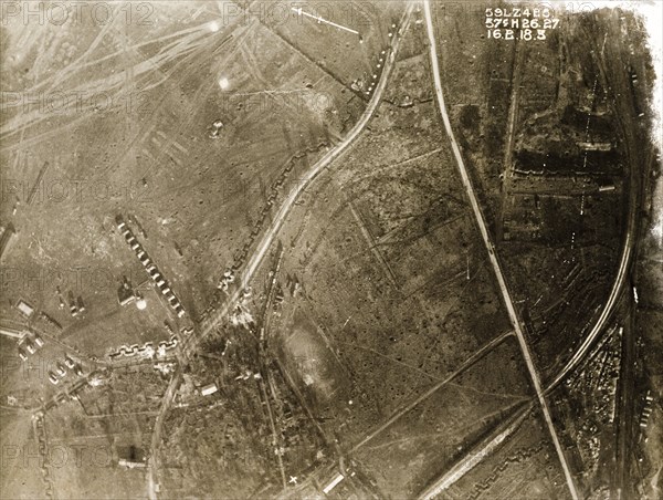 A military camp on the Western Front. One of a series of British aerial reconnaissance photographs recording the positions of trenches on the Western Front during the First World War. A military camp is surrounded by square-toothed trenches and fields pockmarked with bomb craters. Nord-Pas de Calais or Picardie, France, 16 February 1918., Nord-Pas de Calais, France, Western Europe, Europe .