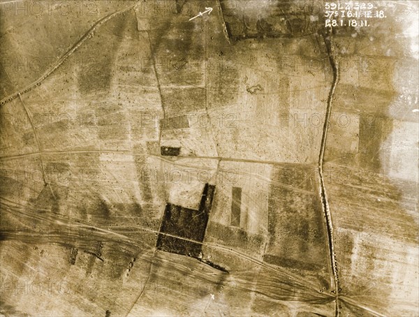 Transport tracks and bomb craters. One of a series of British aerial reconnaissance photographs recording the positions of trenches on the Western Front during the First World War. Transport tracks run across a patchwork of fields pockmarked with bomb craters. Nord-Pas de Calais or Picardie, France, 28 January 1918., Nord-Pas de Calais, France, Western Europe, Europe .