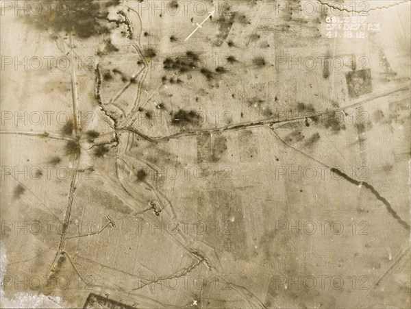 Shell blasts in the snow. One of a series of British aerial reconnaissance photographs recording the positions of trenches on the Western Front during the First World War. Dark shell blasts and trenches stand out against a snow-covered battlefield. Nord-Pas de Calais or Picardie, France, 4 January 1918., Nord-Pas de Calais, France, Western Europe, Europe .