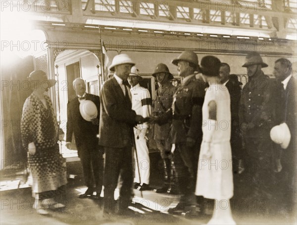 The Earl of Reading arrives in Bombay, 1926. The Earl of Reading and his wife (left) disembark from a train at Bombay's Victoria Terminus (Chhatrapati Shivaji Terminus) to be met by a number of government officials. The Earl shakes hands with First Baron Birdwood, the Commander in Chief of the British Indian Army. Bombay (Mumbai), India, 1926. Mumbai, Maharashtra, India, Southern Asia, Asia.