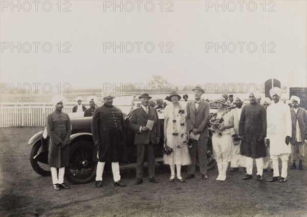 The Maharajah of Kolhapur greets the Lawrences. Sir Henry Staveley Lawrence, Acting Governor of Bombay (centre left), is accompanied by his wife and daughter at a welcome reception hosted by the Maharajah of Kolhapur, Rajaram II Bonsle (r.1922-40) (second from left). Kolhapur, Kolhapur State (Maharashtra), India, 14 October 1925. Kolhapur, Maharashtra, India, Southern Asia, Asia.