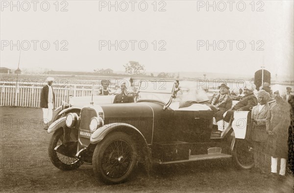 Maharajah of Kolhapur with the Acting Governor of Bombay. Sir Henry Staveley Lawrence, Acting Governor of Bombay, sits inside an open-topped car with the Maharajah of Kolhapur, Rajaram II Bonsle (r.1922-40), during his official visit to Kolhapur. Kolhapur, Kolhapur State (Maharashtra), India, 14 October 1925. Kolhapur, Maharashtra, India, Southern Asia, Asia.
