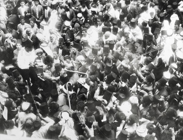 An altercation in Jerusalem, 1933. A tightly packed crowd of Palestinian Arabs and Jews form an agitated mass on a city street as tensions rise over the influx of Jewish immigrants to the British Mandate of Palestine. This photograph was taken only three days after a violent altercation in Haifa in which 26 people were killed. Jerusalem, British Mandate of Palestine (Israel), 29 October 1933. Jerusalem, Jerusalem, Israel, Middle East, Asia.