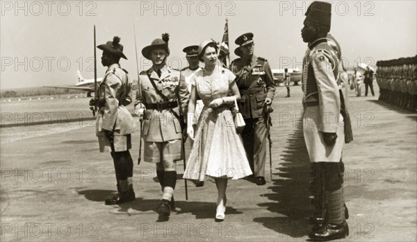 Queen Elizabeth II arrives at Kaduna airport. Queen Elizabeth II inspects the newly renamed Queen's Own Nigeria Regiment of the Royal West African Frontier Force on her arrival at Kaduna airport. Kaduna, Nigeria, February 1956. Kaduna, Kaduna, Nigeria, Western Africa, Africa.