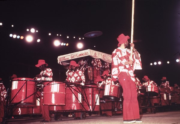 Lever Brothers Gay Flamingoes. A steel band called the 'Lever Brothers Gay Flamingoes' perform in costume during a cultural festival held at the Commonwealth Institute. London, England, circa 1980. London, London, City of, England (United Kingdom), Western Europe, Europe .