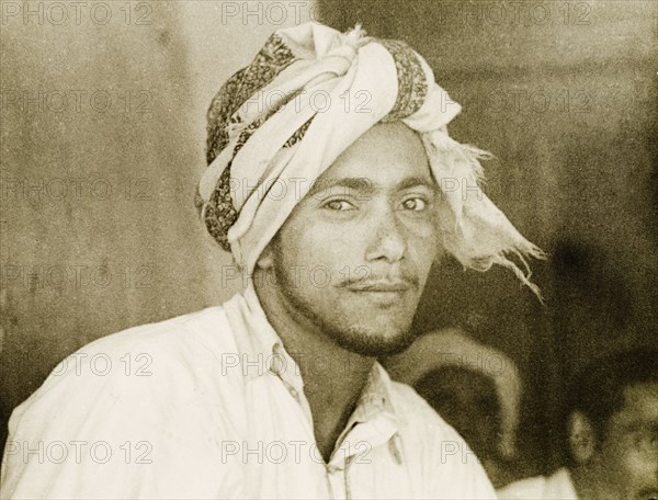 A dhow sailor. Portrait of a turbaned dhow sailor at the port city of Mombasa. Mombasa, Kenya, 1947. Mombasa, Coast, Kenya, Eastern Africa, Africa.