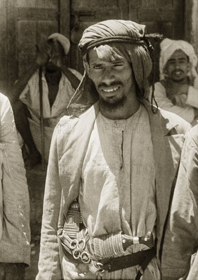 Manga Arab dhow captain. Portrait of a Kanuri dhow captain, carrying a large crooked 'jembia' (dagger) in his belt. Zanzibar (Tanzania), circa 1947. Zanzibar Town, Zanzibar Urban/West, Tanzania, Eastern Africa, Africa.