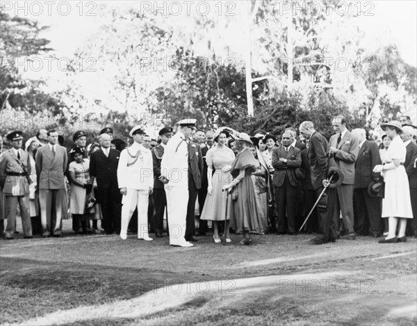 Princess Elizabeth meets Lady Macmillan. Lady Dorothy Evelyn Macmillan is presented to Princess Elizabeth and the Duke of Edinburgh during an official garden party at Government House. Nairobi, Kenya, February 1952. Nairobi, Nairobi Area, Kenya, Eastern Africa, Africa.