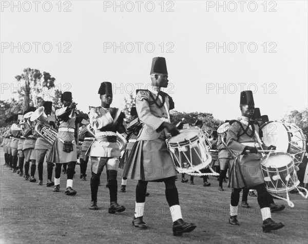 A King's African Rifles band. A King's African Rifles band performs during an official garden party held for Princess Elizabeth and the Duke of Edinburgh at Government House. Nairobi, Kenya, February 1952. Nairobi, Nairobi Area, Kenya, Eastern Africa, Africa.