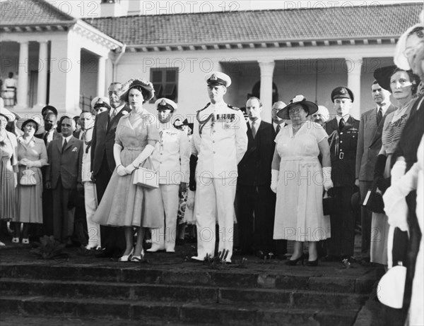 Princess Elizabeth watches a King's African Rifles band. Princess Elizabeth and the Duke of Edinburgh gather with guests to watch a King's African Rifles band perform during an official garden party at Government House. Nairobi, Kenya, February 1952. Nairobi, Nairobi Area, Kenya, Eastern Africa, Africa.