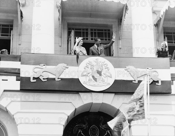 Princess Elizabeth and the Duke of Edinburgh at Nairobi City Hall. Princess Elizabeth and the Duke of Edinburgh wave to well-wishers from the balcony of Nairobi City Hall. Nairobi, Kenya, February 1952. Nairobi, Nairobi Area, Kenya, Eastern Africa, Africa.