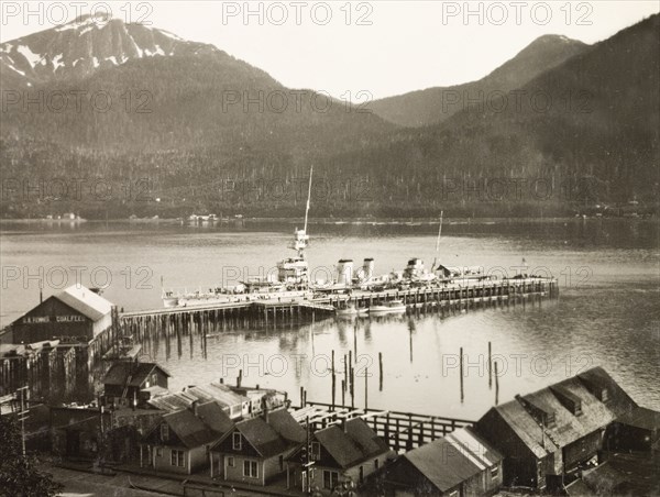HMS Dauntless at Juneau Pier. HMS Dauntless of the Royal Navy's South American Division anchored alongside Juneau pier in the Gastineau Channel. Juneau, Alaska, United States of America, circa 1931. Juneau, Alaska, United States of America, North America, North America .