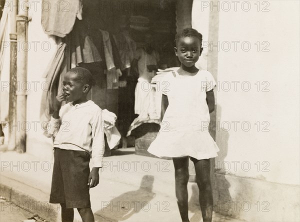 Two Jamaican children. Two young Jamaican children standing on a street in Kingston. Kingston, Jamaica, circa 1931. Kingston, Kingston, Jamaica, Caribbean, North America .