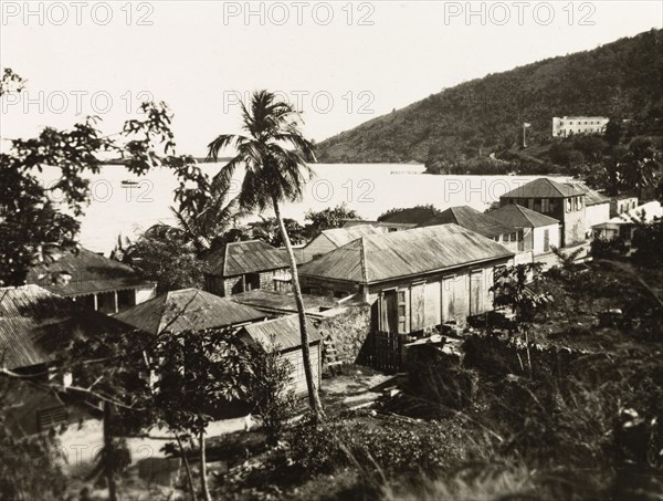 Tortola. View over a coastal settlement on the island of Tortola to the Caribbean Sea. Tortola, British Virgin Islands, circa 1931., Tortola, British Virgin Islands, Caribbean, North America .