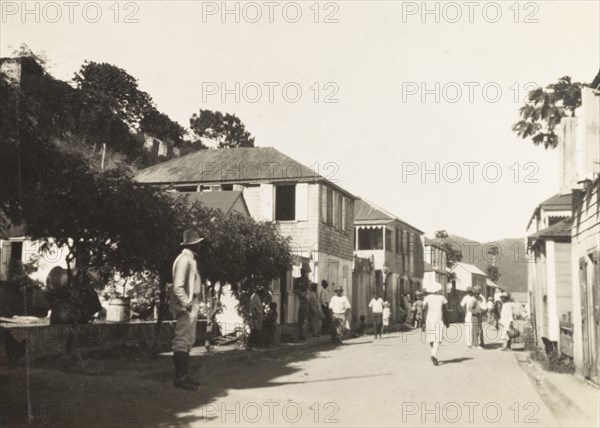 Main Street, Tortola. View along Main Street in Road Town, a street flanked by weatherboarded buildings and bustling with pedestrians. Road Town, Tortola, British Virgin Islands, circa 1931. Road Town, Tortola, British Virgin Islands, Caribbean, North America .