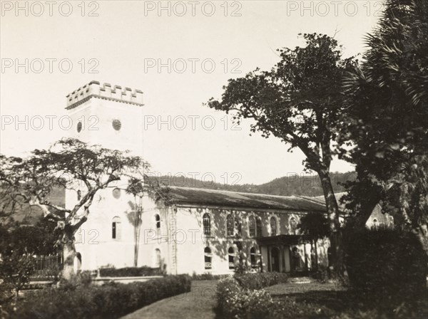 St. George's Anglican Cathedral, St Vincent. View of St George's Anglican Cathedral in Kingstown. Built in circa 1820 in Georgian architectural style, it features stained-glass windows and a square, crenellated tower. Kingstown, St Vincent, circa 1931. Kingstown, St George (St Vincent and the Grenadines), St Vincent and the Grenadines, Caribbean, North America .