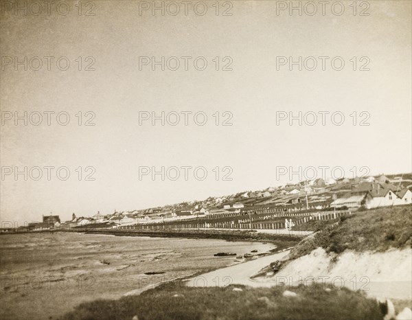 Port Stanley, East Falkland. View along the coastline of the the isle of East Falkland to the town of Stanley. Stanley, Falkland Islands, circa 1931. Stanley, East Falkland, Falkland Islands, South Atlantic Ocean, South America .